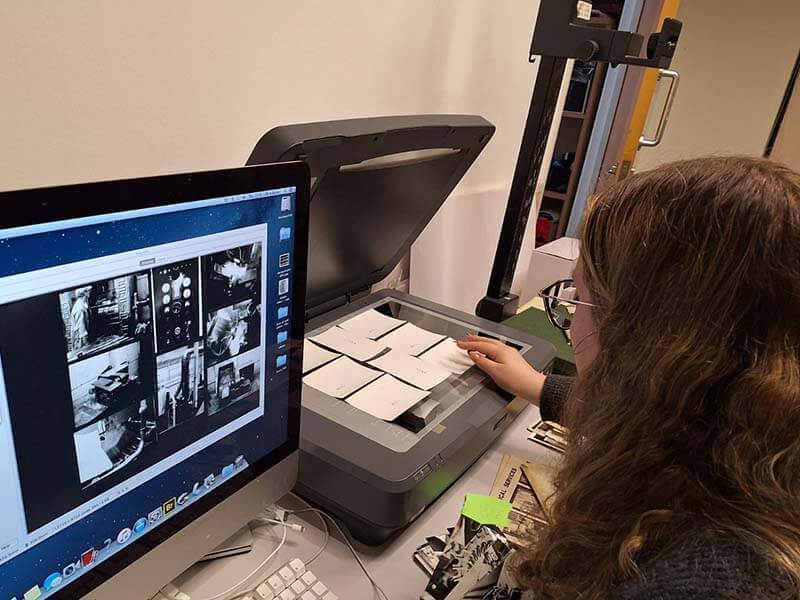 Cerys Robinson scanning photographs in the Royal Mint Museum.jpg