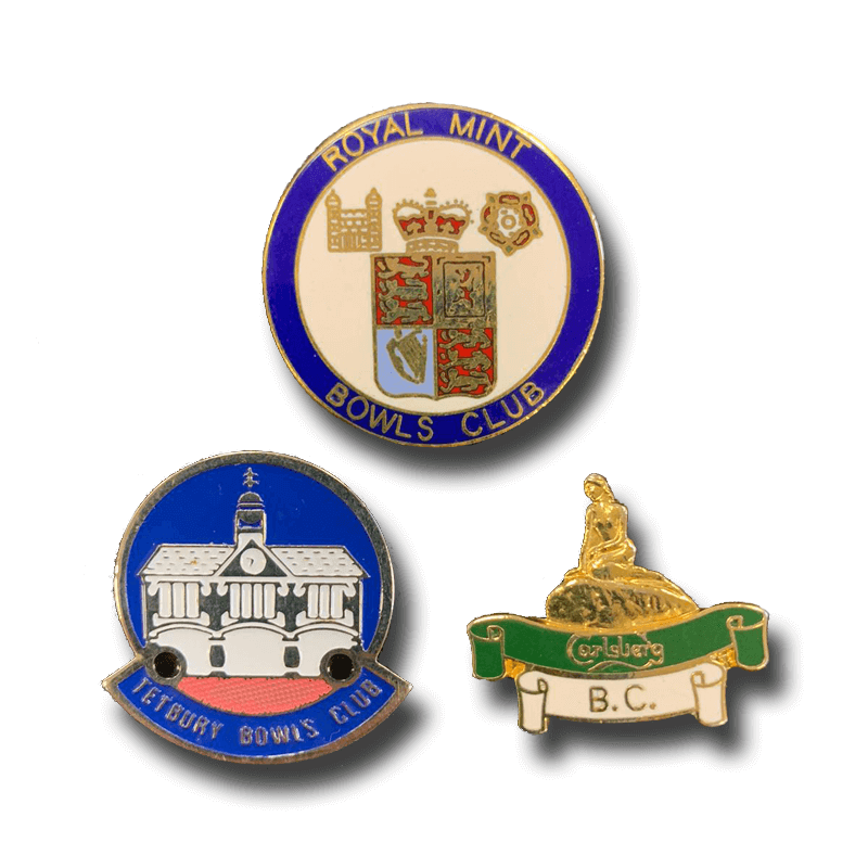 Pin badges with the logos of several bowling clubs including the Royal Mint