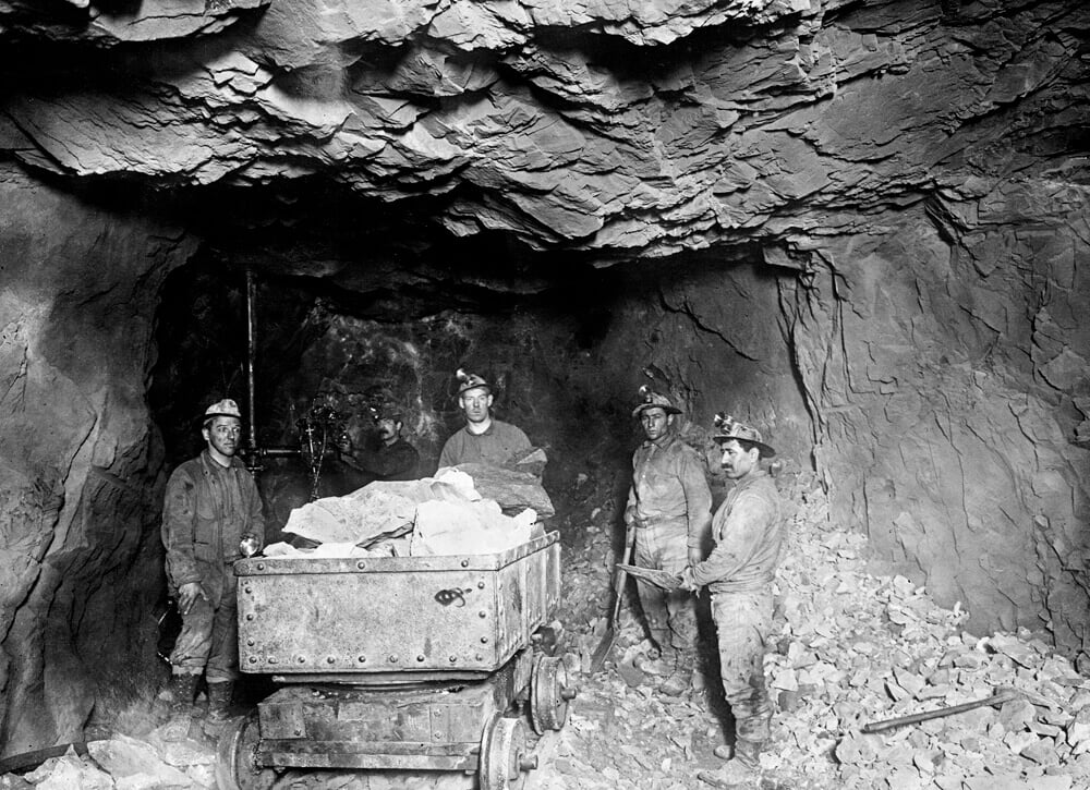 Miners loading a mine car in a coal mine in America-Mary Evans Library of Congress.jpg