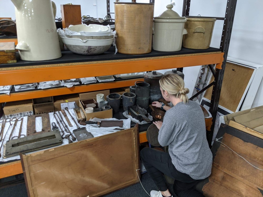 Abigail tidying shelves in the store.jpg