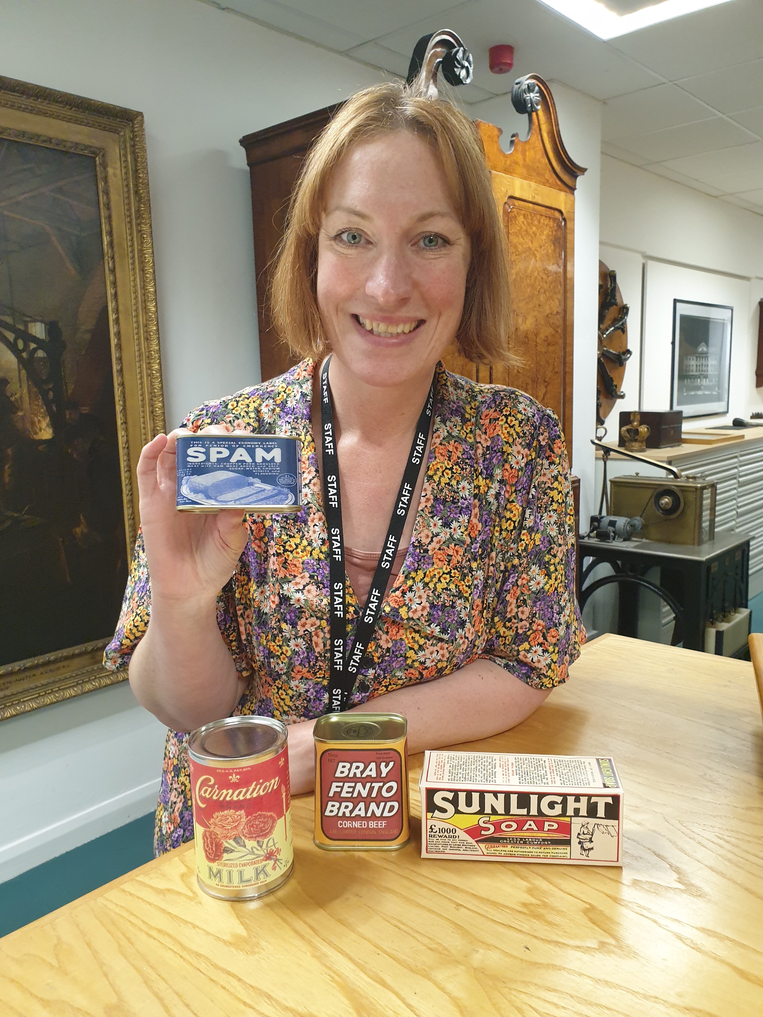 Our Education Manager with replica tins for the new workshop