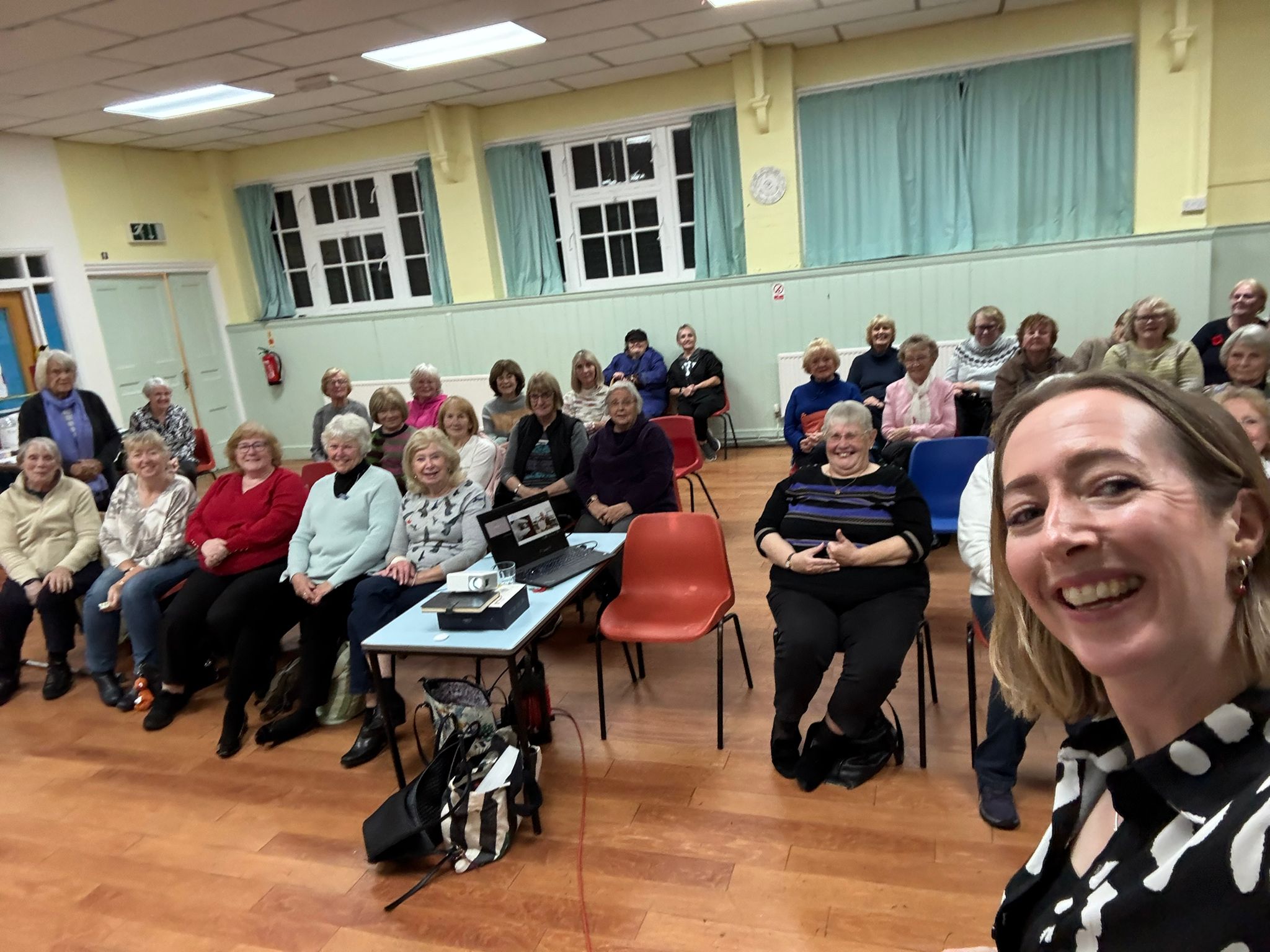 A photograph of Abigail with the Rogerstone Roses WI group