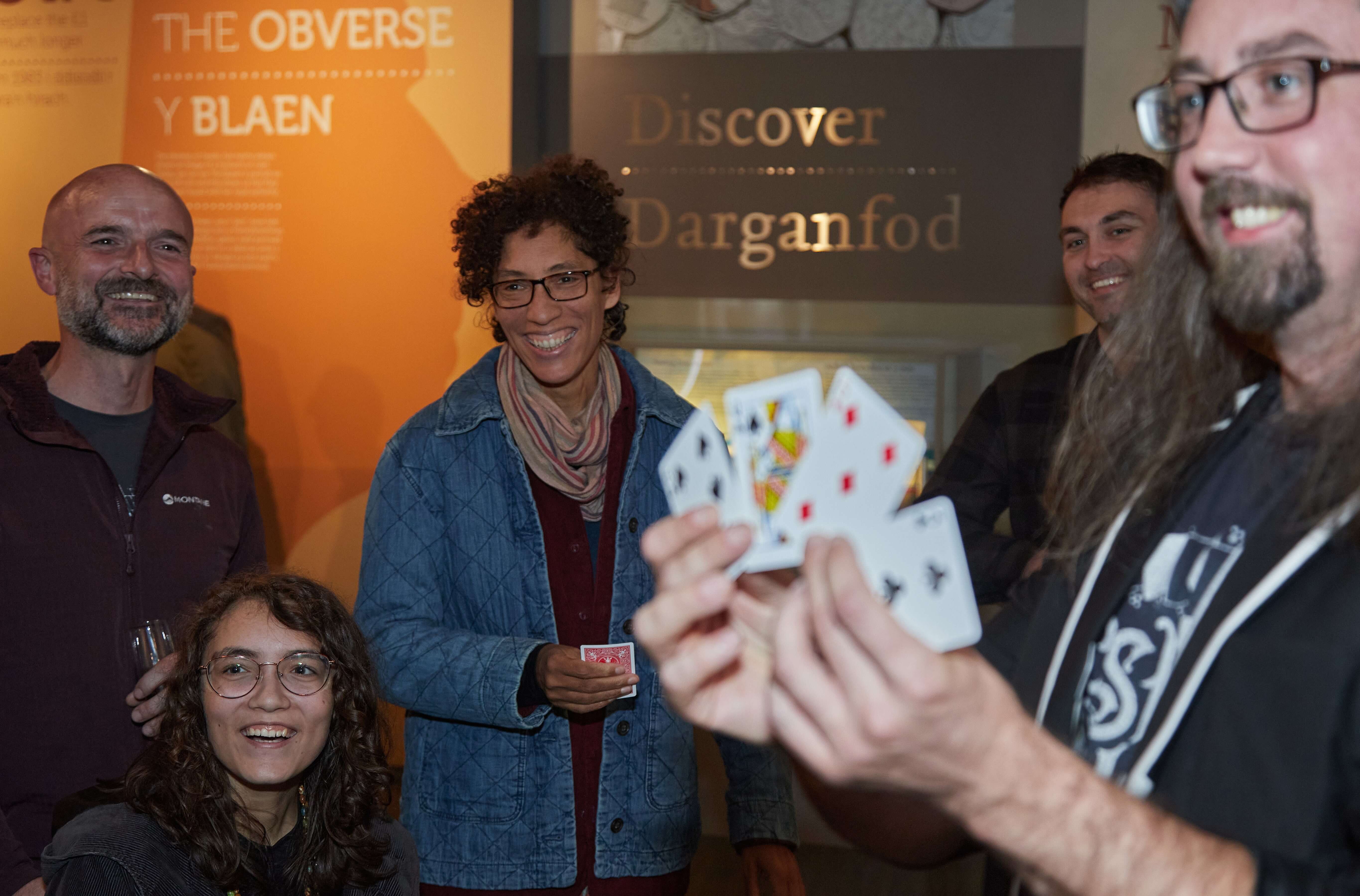 Magician Josh Hooper performing to a crowd