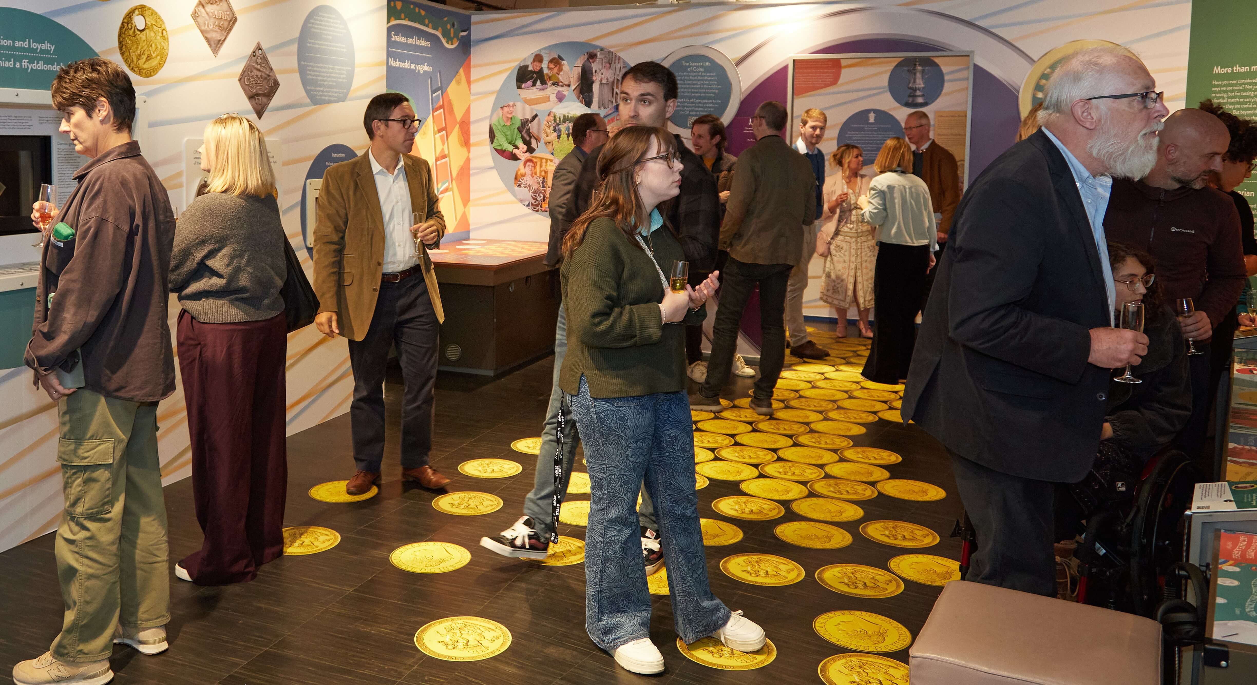 Guests viewing The Secret Life of Coins Exhibition