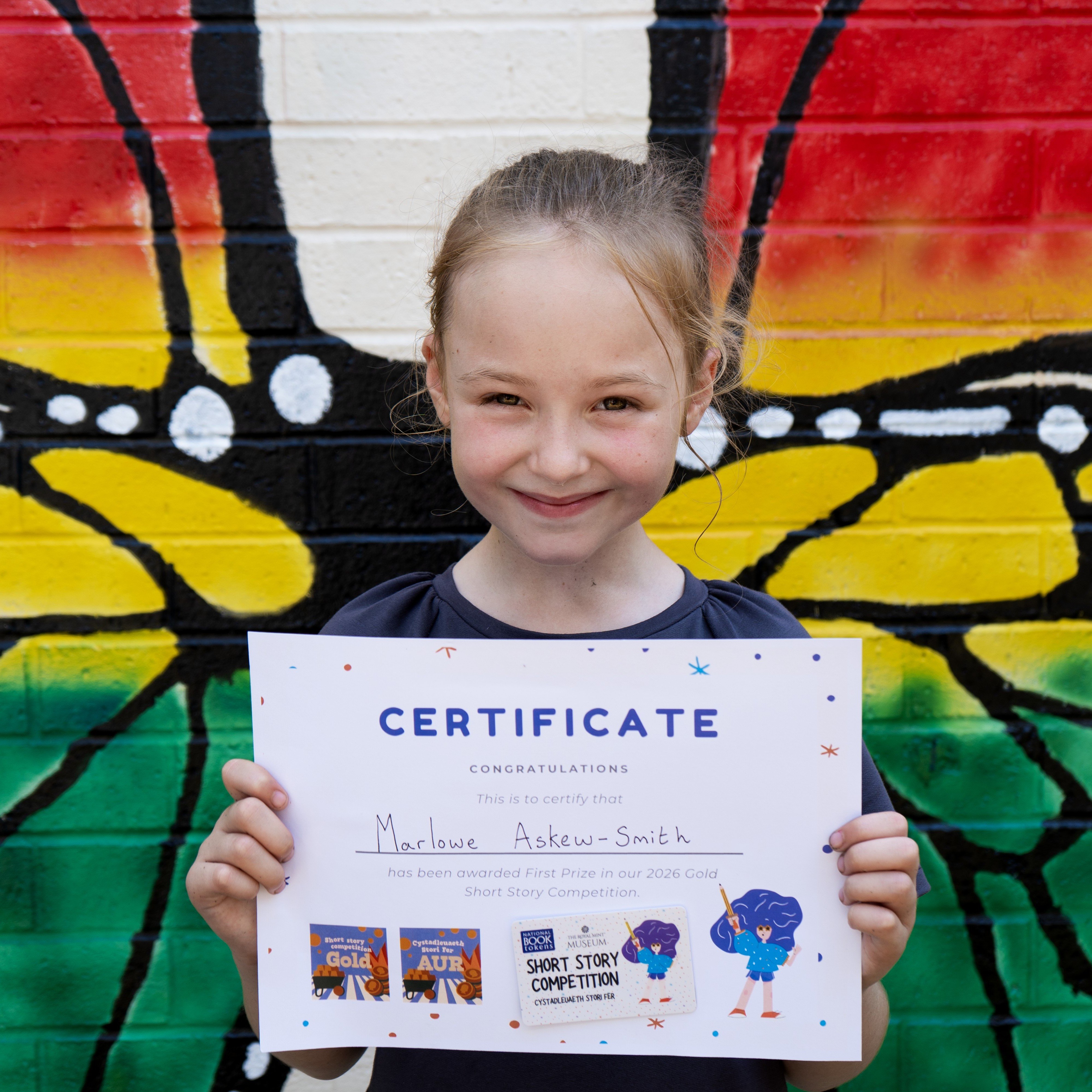 Marlowe with her certificate and book voucher