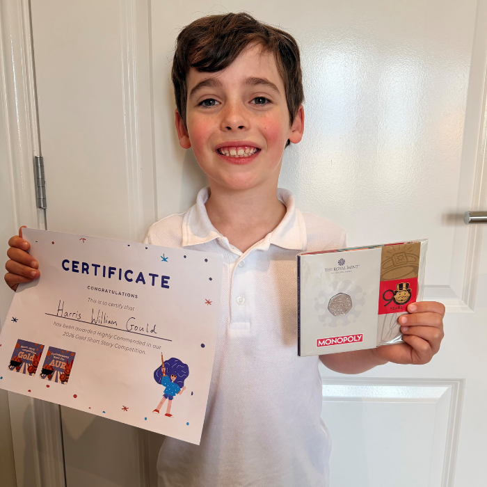 Harris holding the certificate and prize