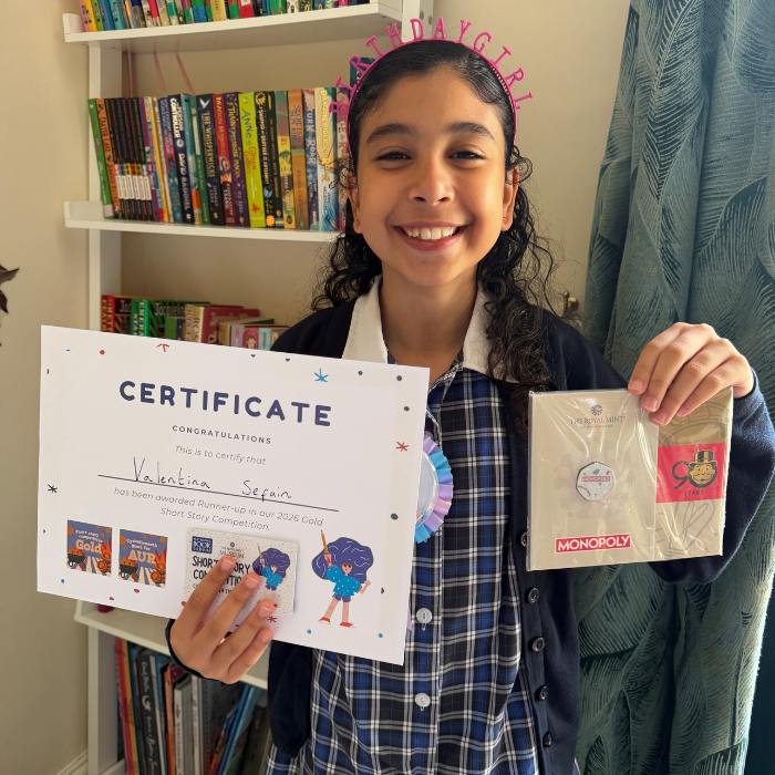 Valentina holding the certificate and prize