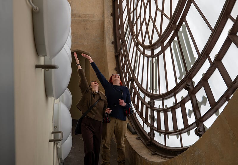 Standing behind the clock face of Big Ben