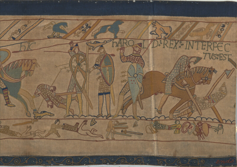 An image of the replica Bayeux Tapestry at Reading Museum this scene shows the Battle of Hastings with cavalry and soldiers fighting
