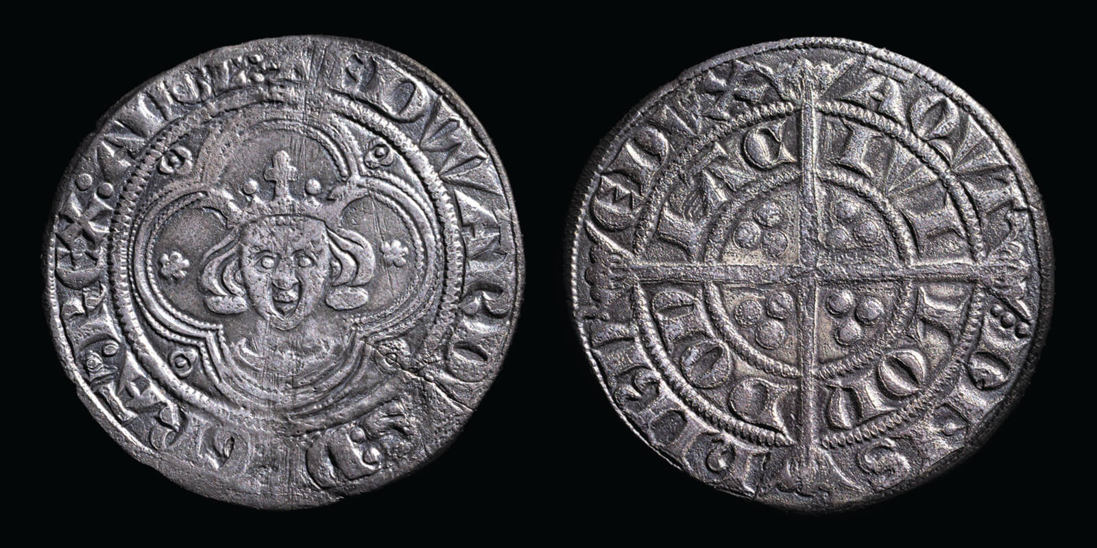 A silver coin known as a groat. The obverse features a stylised version of King Edward I and the reverse a cross and a series of dots