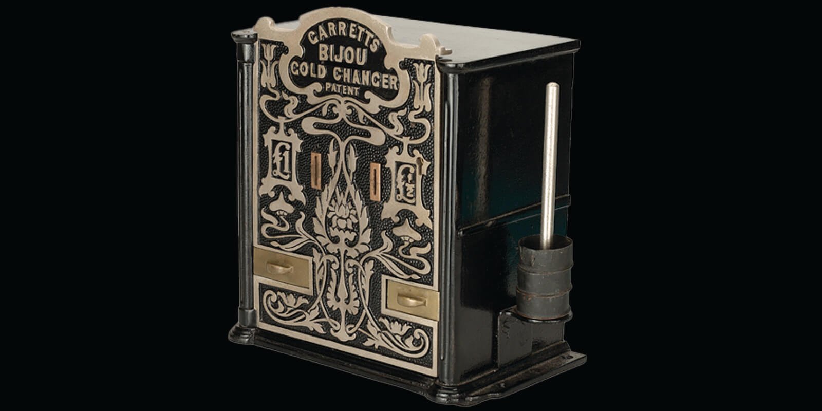 A grey, silver and black metal box with slots to deposit gold sovereign coins and trays at the bottom which would have dispensed silver change