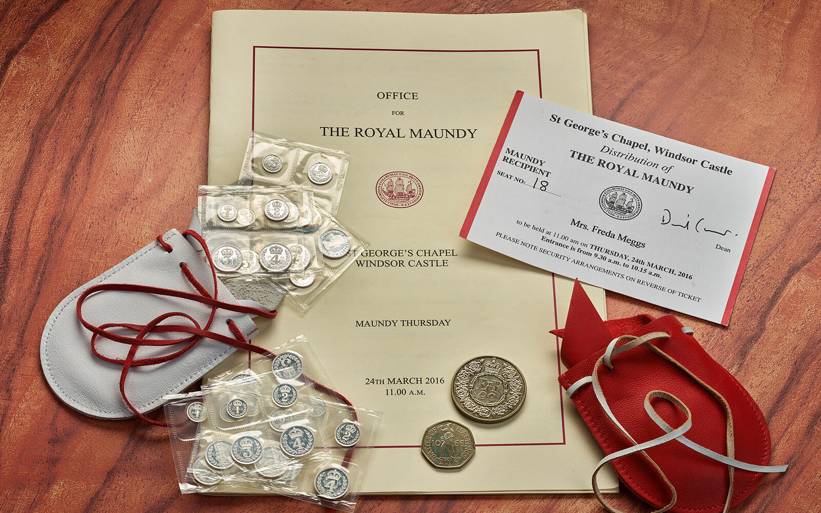 Maundy Donation Collection to the Museum from Mrs Freda Meggs in June 2022. Includes paperwork, an invitation and coins with red and white purses.