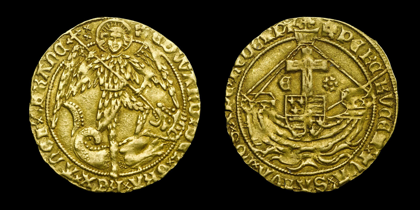 An old gold coin called an angel with an image of the archangel Michael on the obverse. The coin is pierced to allow it to be worn on a necklace