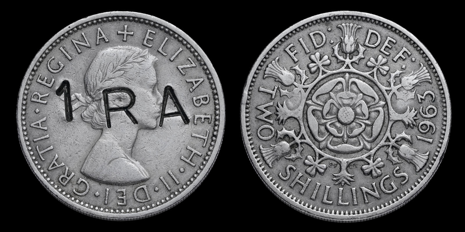 A two shilling coin of 1963 stamped over with the letters IRA